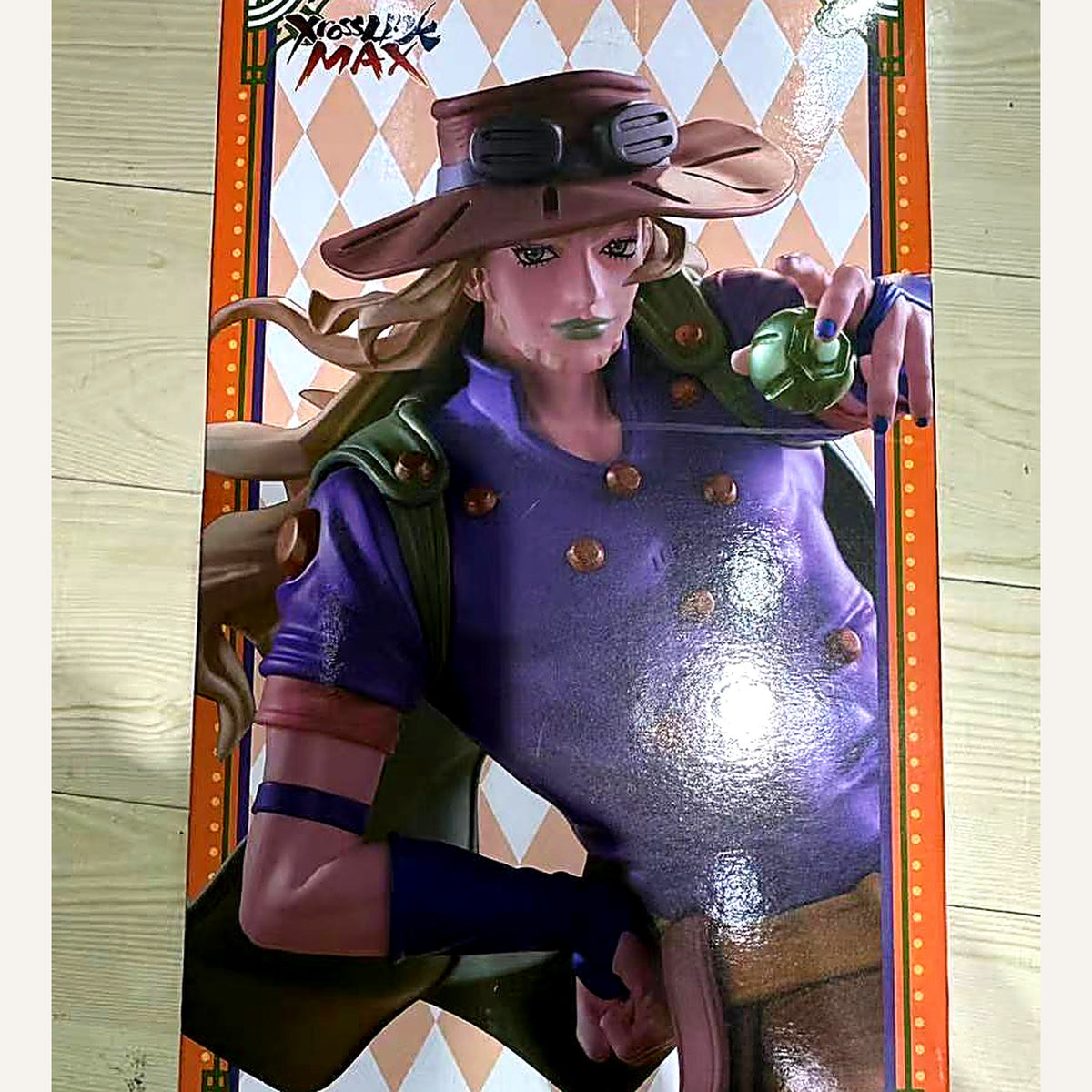 Close-up of the Gyro Zeppeli figure artwork, hat and goggles detail