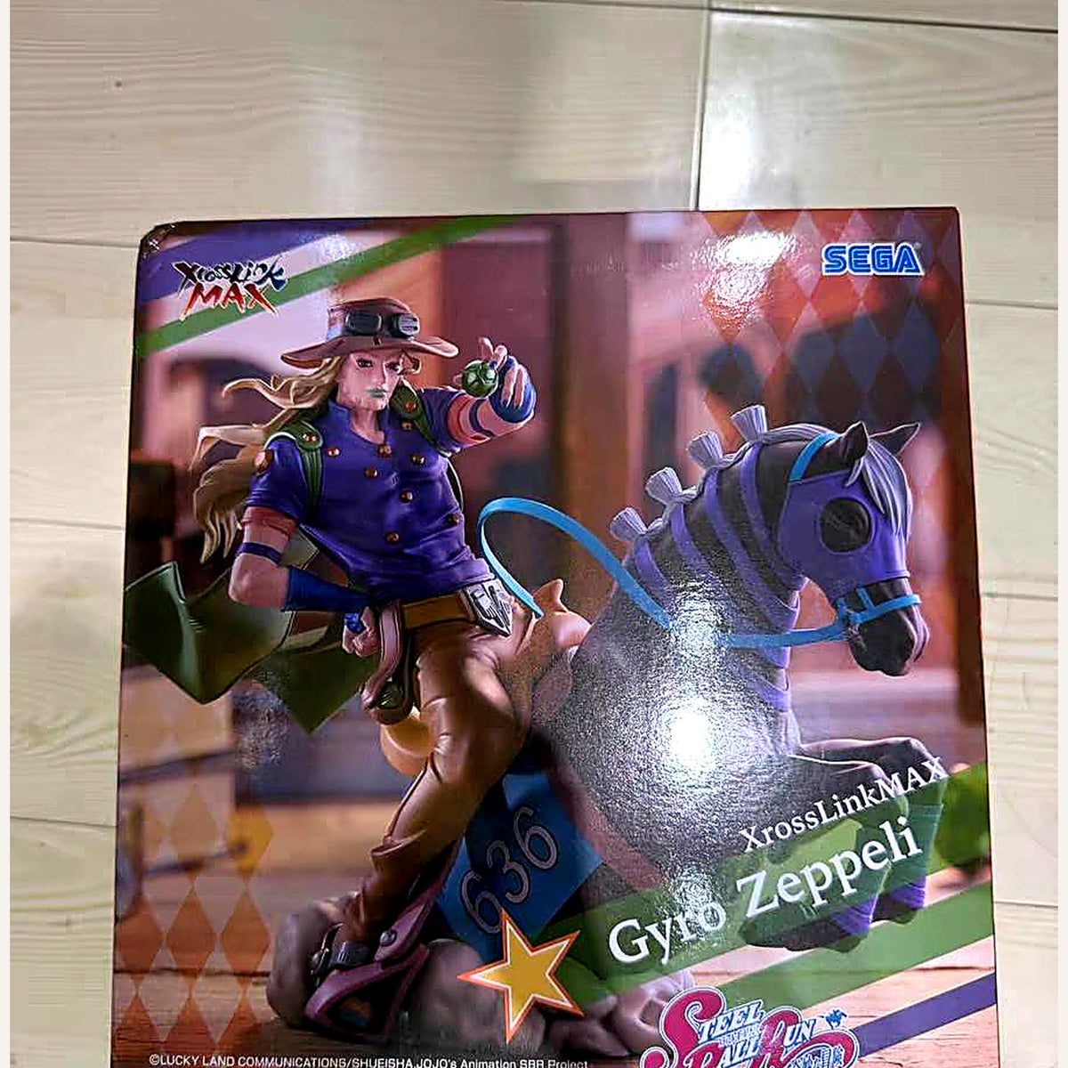 Gyro Zeppeli prize figure box at an angle, SEGA XrossLink MAX
