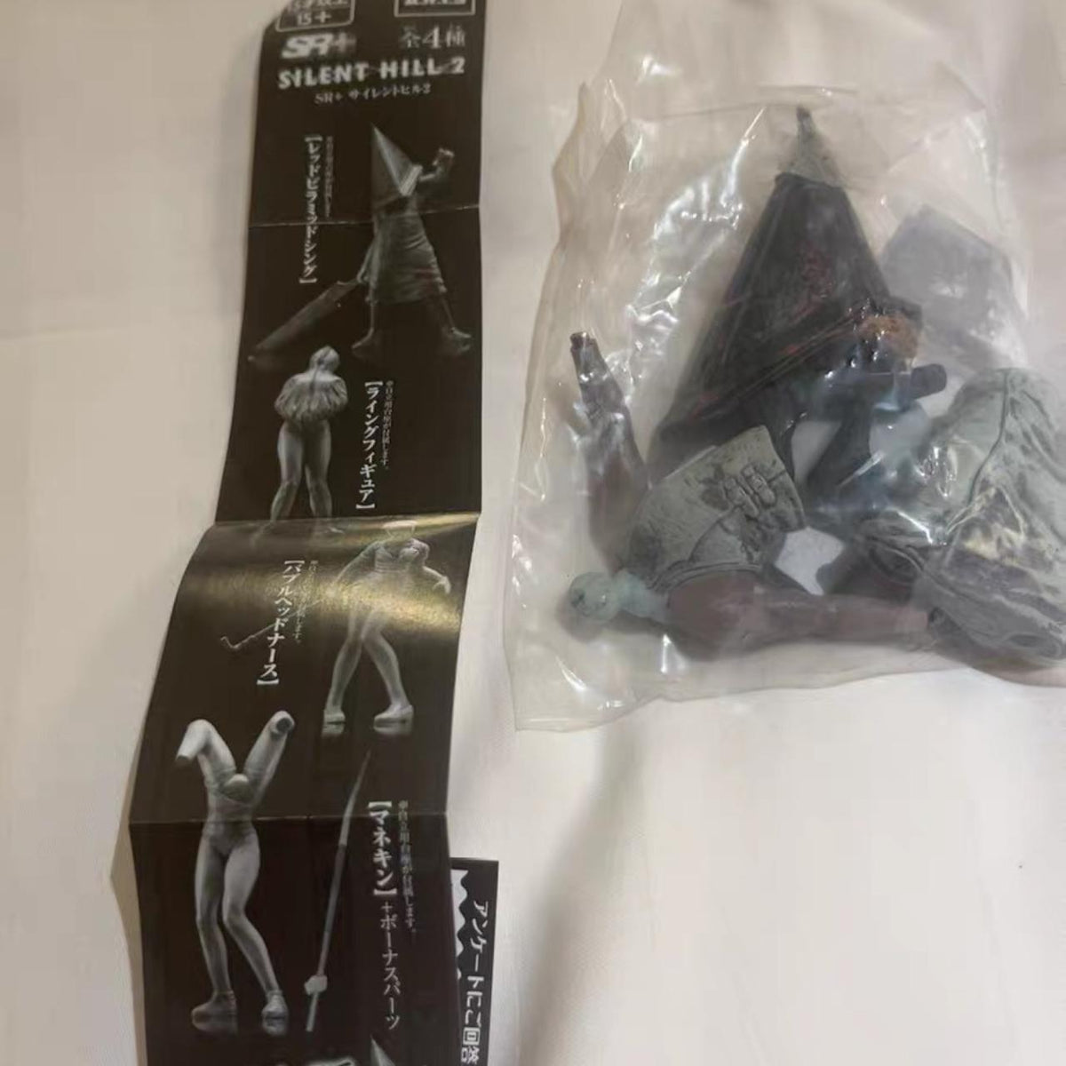 Pyramid-helm figure in original capsule packaging