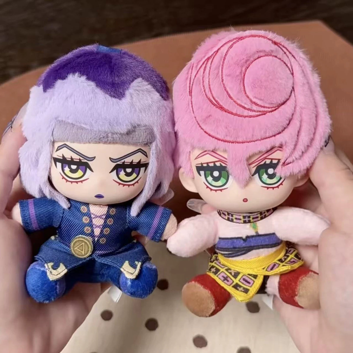 JoJo's Bizarre Adventure Golden Wind plush keychain lineup held in hand for scale