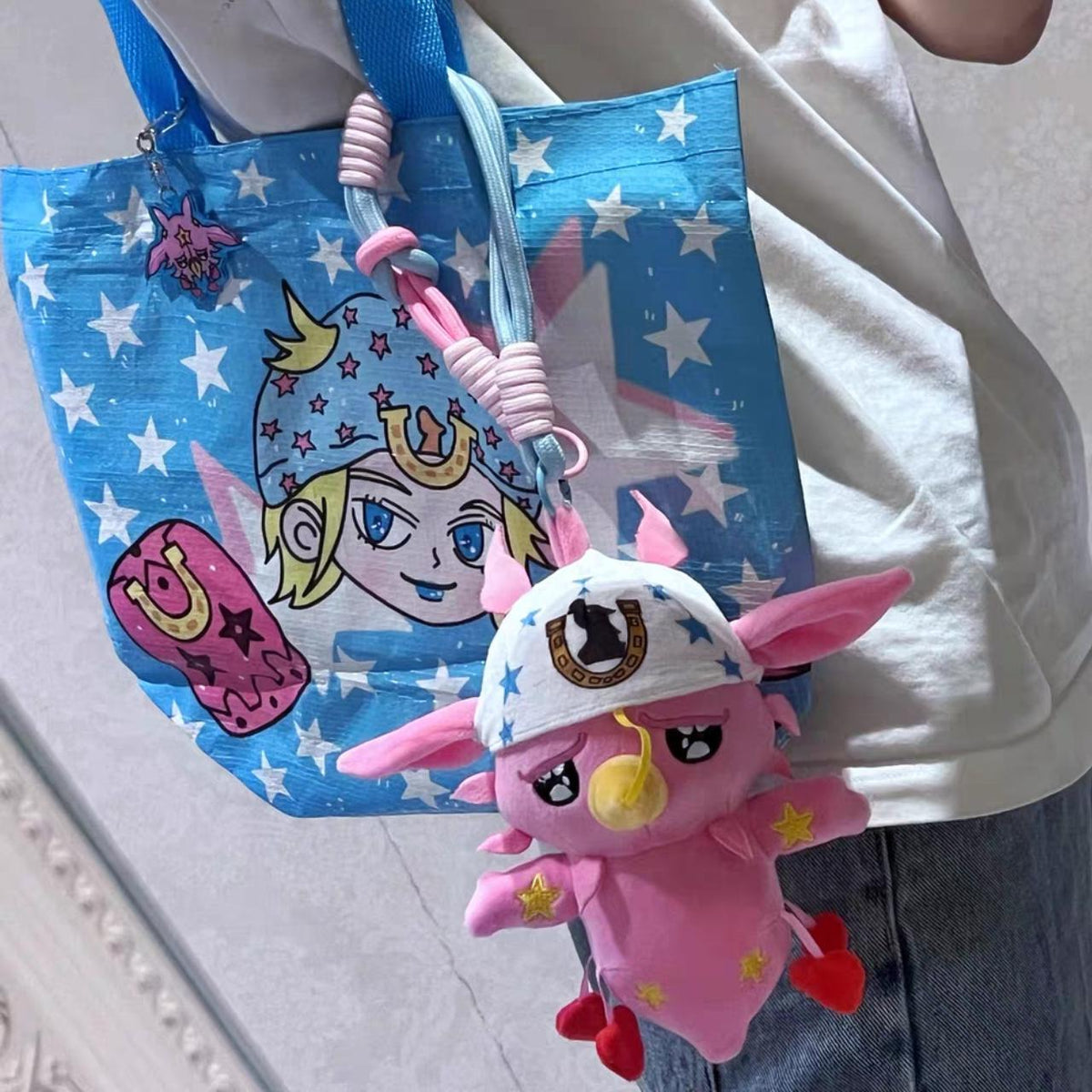 Pink Star Plush Keychain - clipped to a tote bag strap