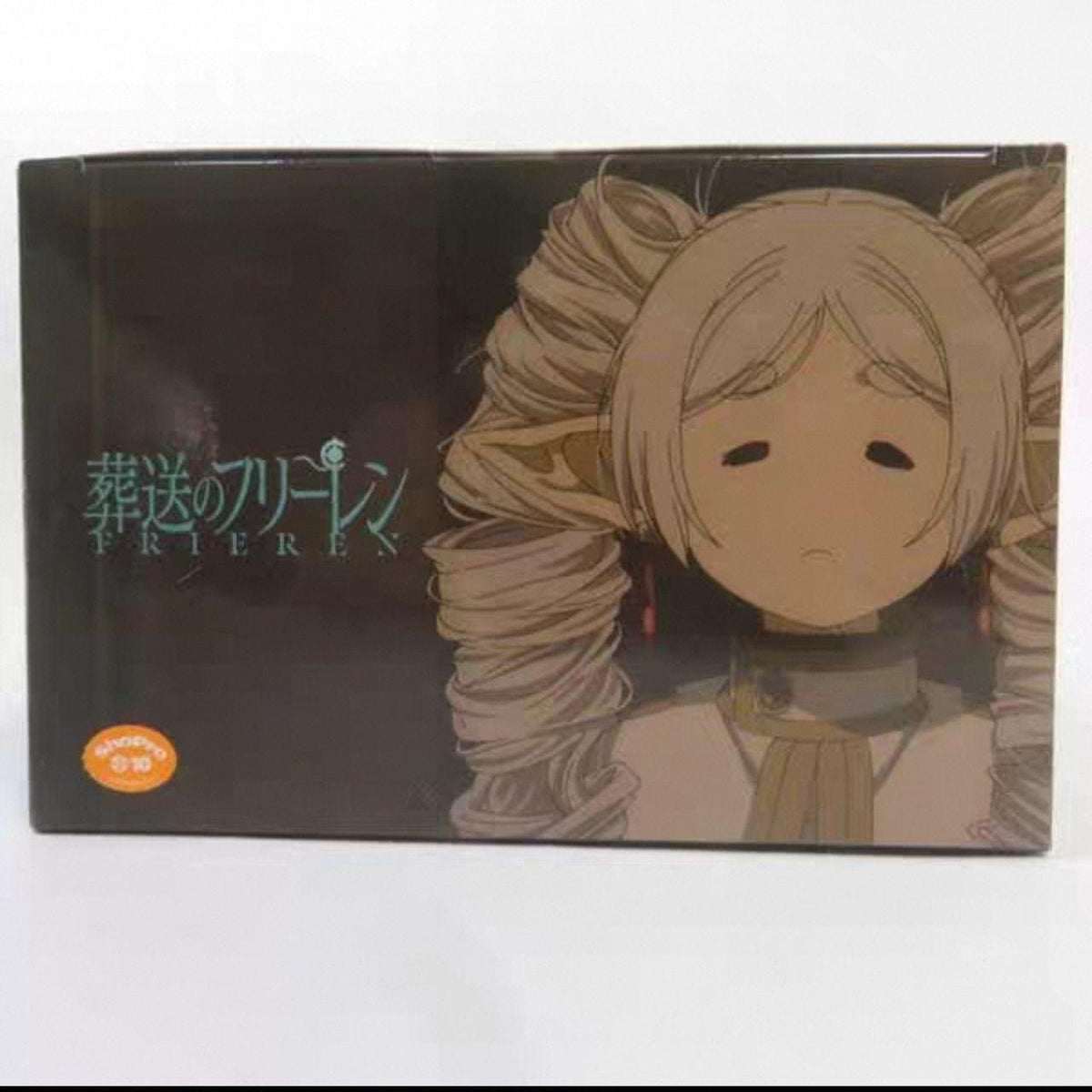 Top of the Frieren tissue box packaging — Frieren: Beyond Journey's End title with her face and twin hair loops