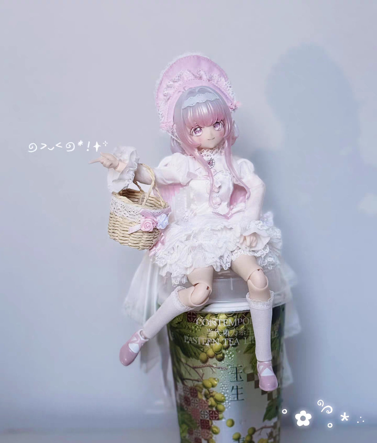 Melliel BJD displayed on pedestal for scale